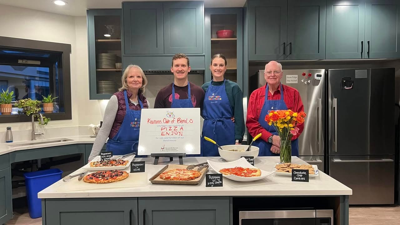 Kiwanis members cooking at the Ronald McDonald House